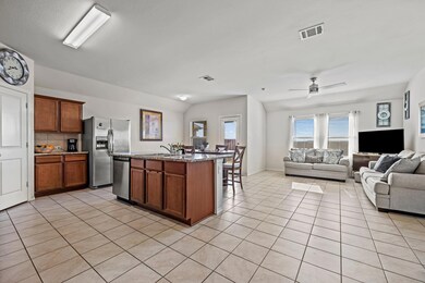 Open floor plan and tile flooring throughout the l