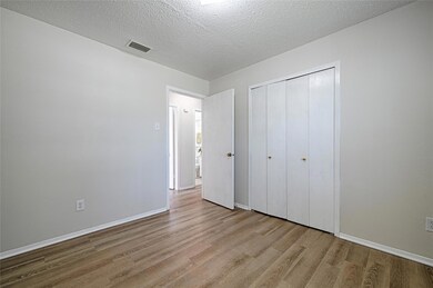 Unfurnished 1st secondary bedroom to the left of t
