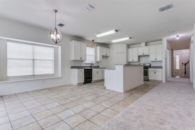 Sunny kitchen with new granite countertops.
