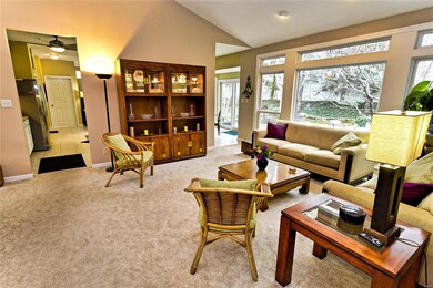 Open floor plan with vaulted ceilings.