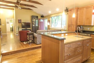 Kitchen island with prep sink, breakfast bar and g