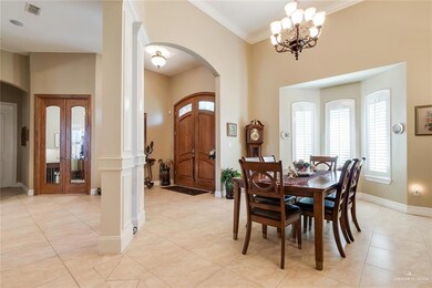 Entryway, Dining Room, and Doors to Office.