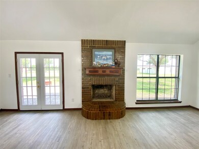 This home is light, bright, and super clean!  On those cool Texas evenings, you'll love the warm glow of this wood burning fireplace.