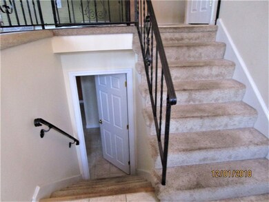 FOYER AND STAIRS TO UPPER LEVEL AND LOWER LEVEL