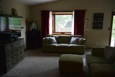 Living room is open to the eat in kitchen area. Bo