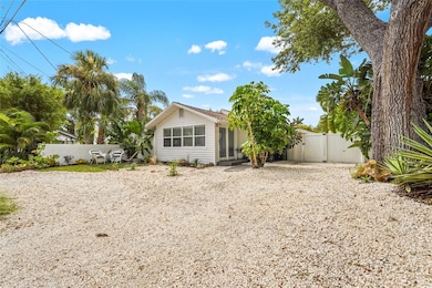 Curb Appeal with Coastal Vibes – Drought-friendly Florida landscaping, a shade-giving oak, and RV/boat-friendly gated alley access set the stage for relaxed, low-maintenance living just minutes from the coast.