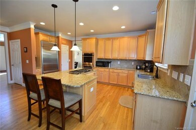 Lots of cabinets, ss appliances, bar counter space