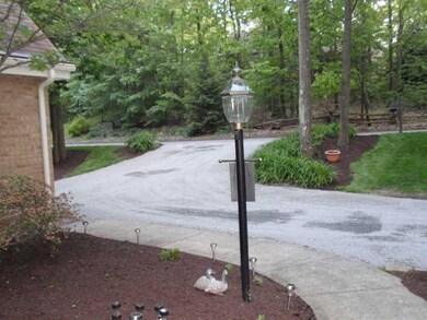 Exterior Front. Front yard boasts 100s of flowerin