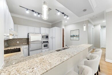 The kitchen is open to the living area and has an