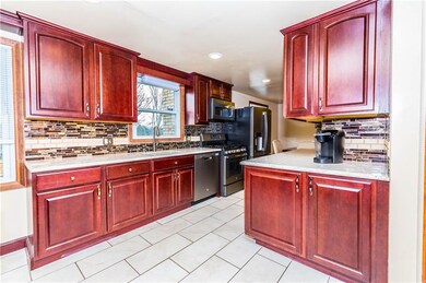 The totally updated kitchen boasts new stainless a