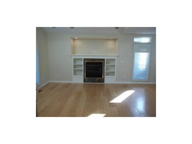 Large family room with plantation shutters and bui