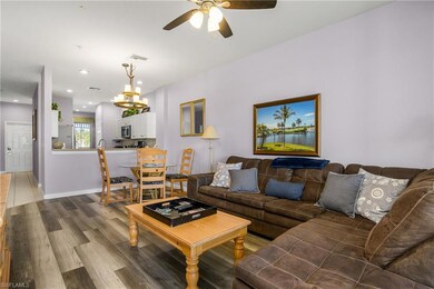Living room with visible vents, wood finished floo