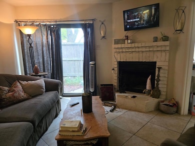 Living room has walkout patio with a fireplace and