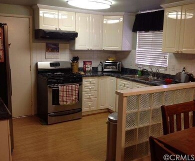 Kitchen with door access to garage where you will 