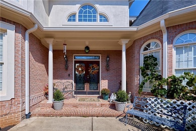 View of exterior entry featuring french doors, a p