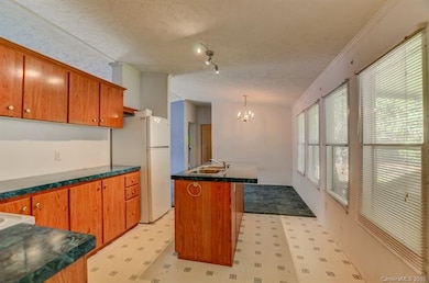 The kitchen has ample cabinet and counter top spac