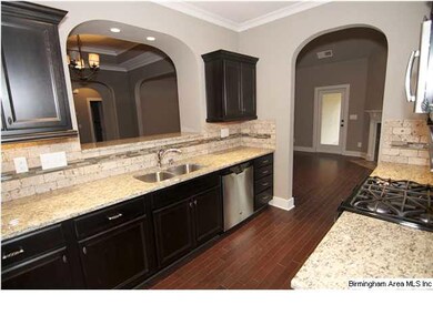 Kitchen with granite countertops, tile backsplash 