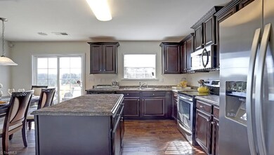 Similar home, same floor plan. Under construction. Options and colors may vary. Home decor, decorative paint and furnishings are not included. All pictures are of a decorated model and are only being used to demonstrate use of space with the plan and are not in actual home.