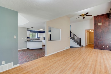 Unfurnished living room featuring light hardwood /