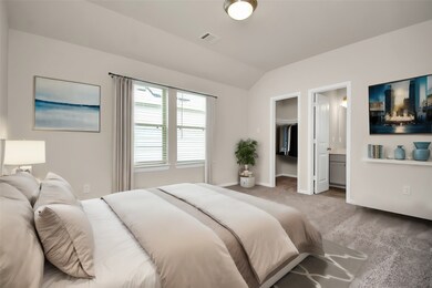 This light-filled master bedroom creates a haven f