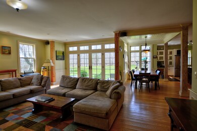 Living room flows into kitchen and out to patio