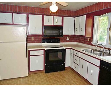 Kitchen. The kitchen is accented with brick consis