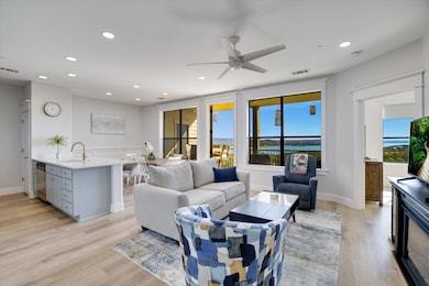 Living area featuring light wood-type flooring, recessed lighting, and a ceiling fan