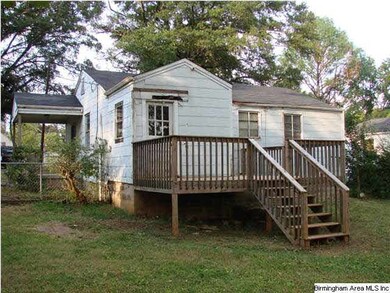 View of back of house from level fenced back yard