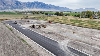 View of mountain backdrop with rural landscape