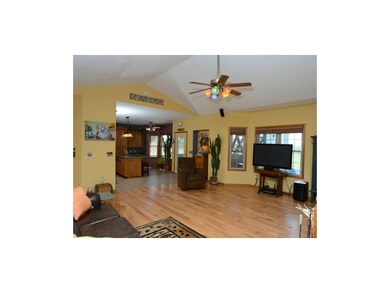 living room opens into kitchen