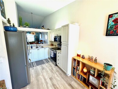 Kitchen with appliances with stainless steel finis