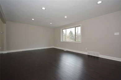 Large window floods the living room with light