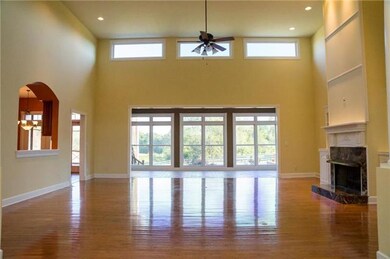 Pass through the foyer into the Heart of the Home, the light filled Living/Family Room w/ gleaming hardwoods & soaring ceilings. Open to the kitchen for the perfect entertaining space! 