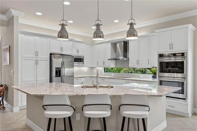 Kitchen with wall chimney range hood, stainless st