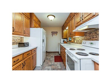 Kitchen. Solid surface counter tops and a mosaic t