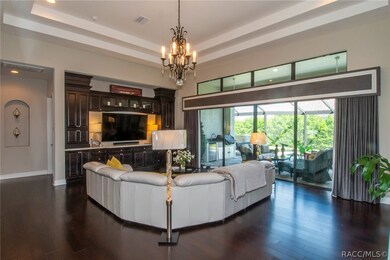 Great room features 
hardwood floors, double tray