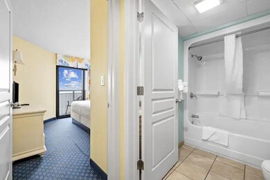 Corridor with light tile patterned floors