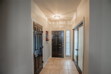 Upon entry you will find French doors leading into