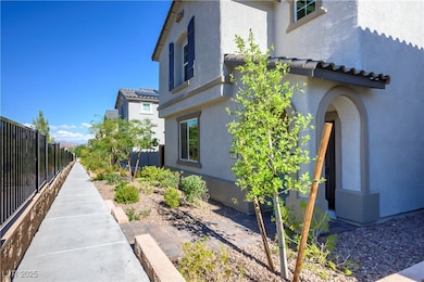 View of side of property featuring stucco siding