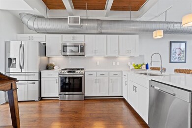 Kitchen with stainless steel appliances, light co