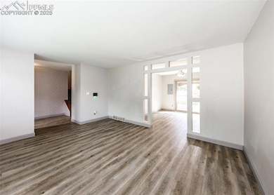 View from Living Room toward Entry on left and Dining Room on right.