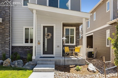 Property entrance with covered porch