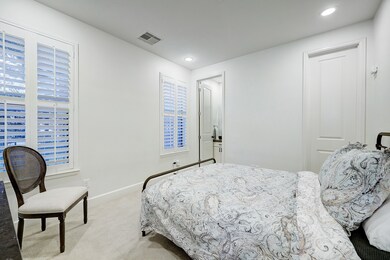 The first-floor secondary bedroom emanates a brigh
