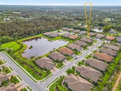 Aerial view featuring a water view and a residenti