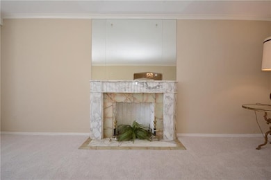 Marble decorative fireplace is a focal point in th