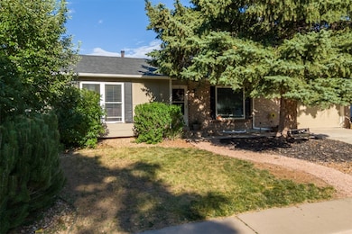 View of front of property with driveway, a garage,
