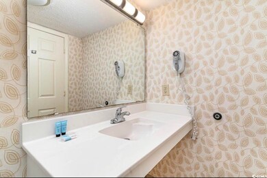 Bathroom featuring vanity and a textured ceiling