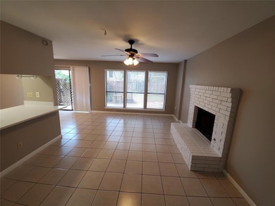 Unfurnished living room featuring a ceiling fan, 