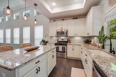 Kitchen with stainless steel appliances, a sink, 