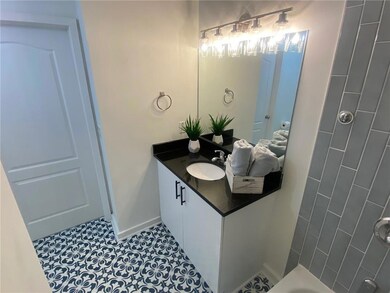 Bathroom with tile floors and vanity